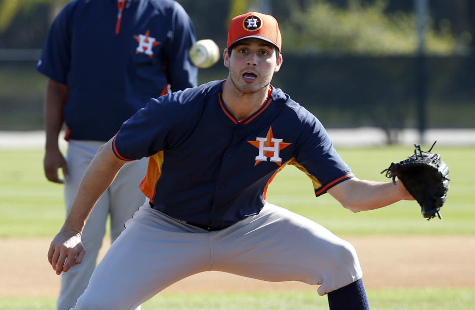 Houston Astros pitcher Mark Appel prepares to field a ball during baseball spring training Wednesday, Feb. 19, 2014, in Kissimmee, Fla. (AP Photo/Alex Brandon)