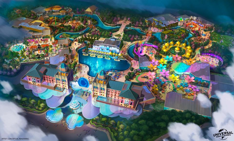 An artist rendering of a new theme park that Universal Parks and Resorts is planning to build in Frisco, Texas. The concept will be set in a lush green landscape and feature immersive themed lands, the company said. January 2023. / Credit: Universal Parks and Resorts