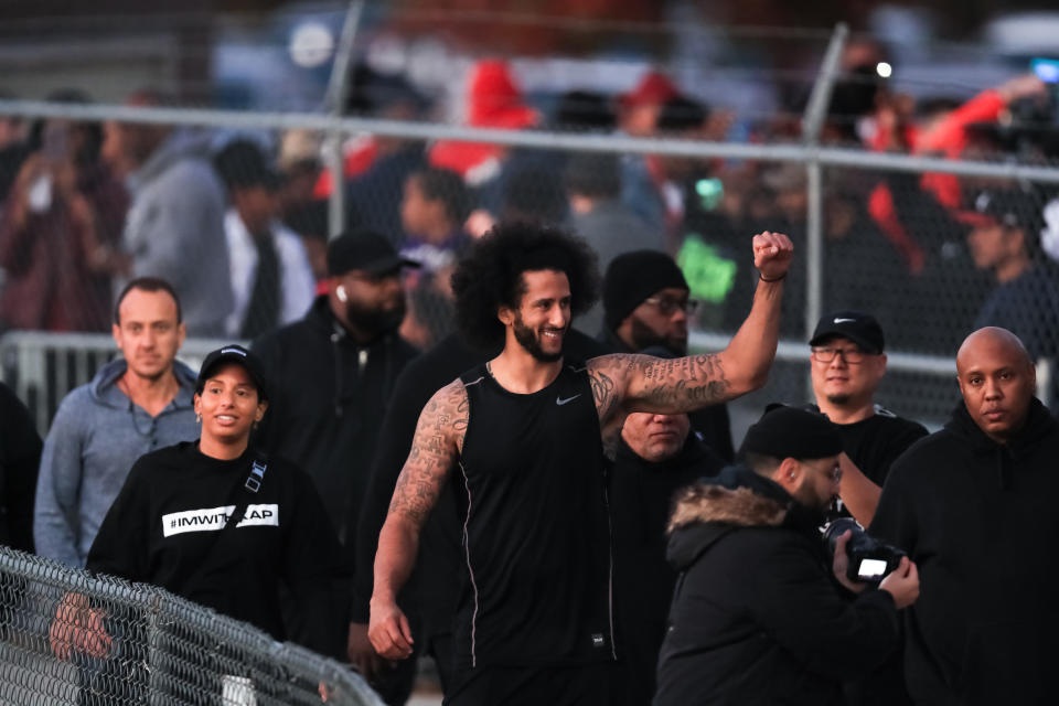 Colin Kaepernick visits with fans following his workout held at Drew High School on Saturday. (Carmen Mandato/Getty Images)       