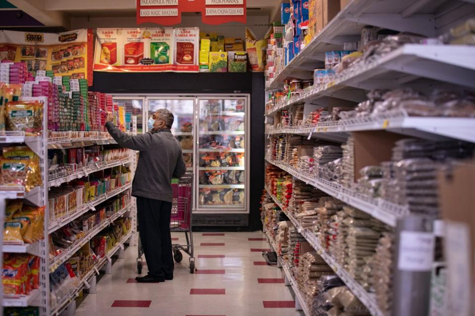 A man shops in a grocery store