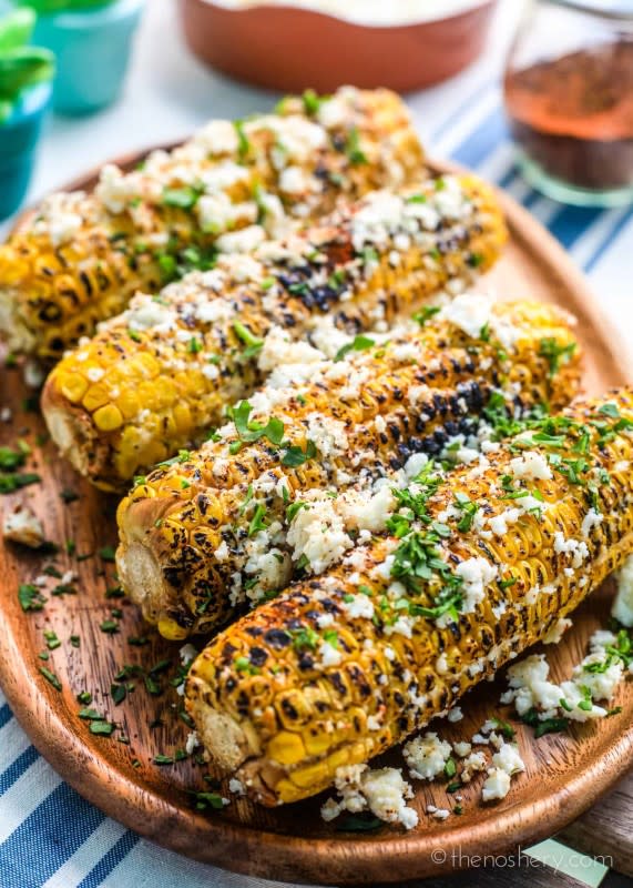 <p>The Noshery</p><p>Also called Mexican Street Corn, these charred kernels are coated with so much deliciousness. Get this <a href="https://thenoshery.com/elote-corn-mexican-street-corn/" rel="nofollow noopener" target="_blank" data-ylk="slk:Elote Corn;elm:context_link;itc:0;sec:content-canvas" class="link ">Elote Corn</a> recipe!</p>