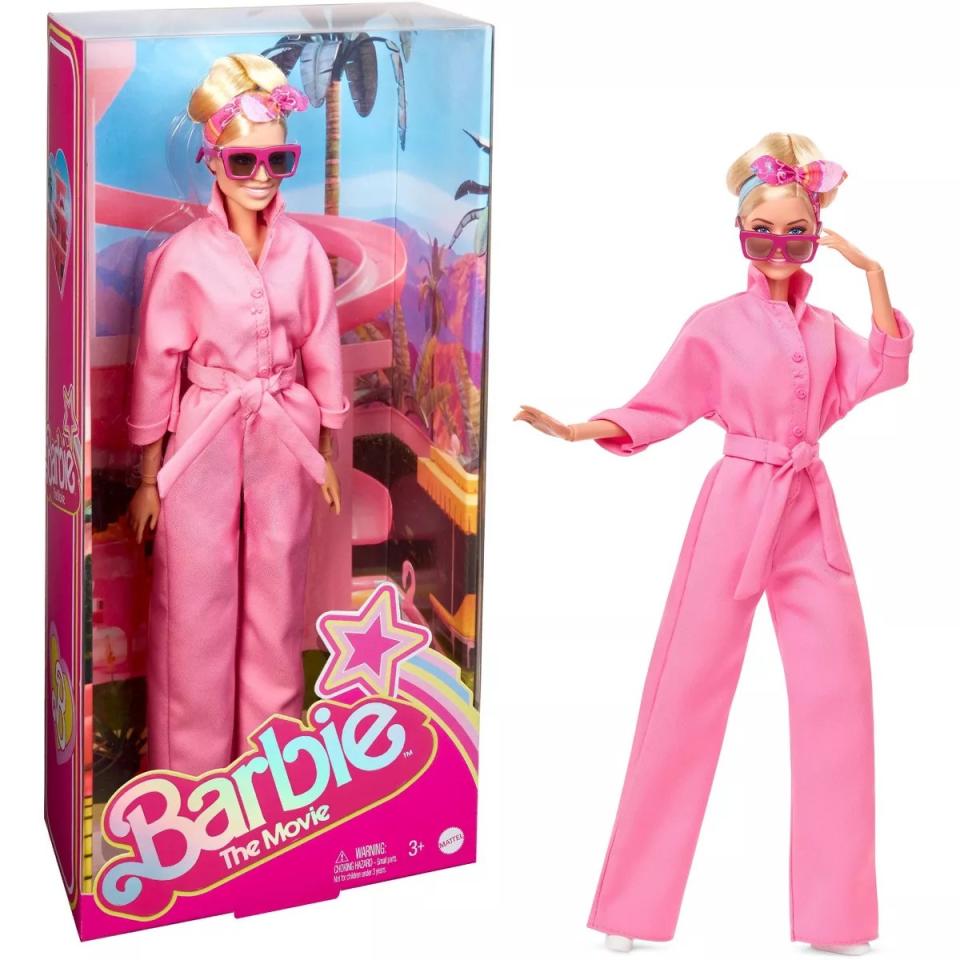 barbie wearing pink jumpsuit with belt and pink sunglasses