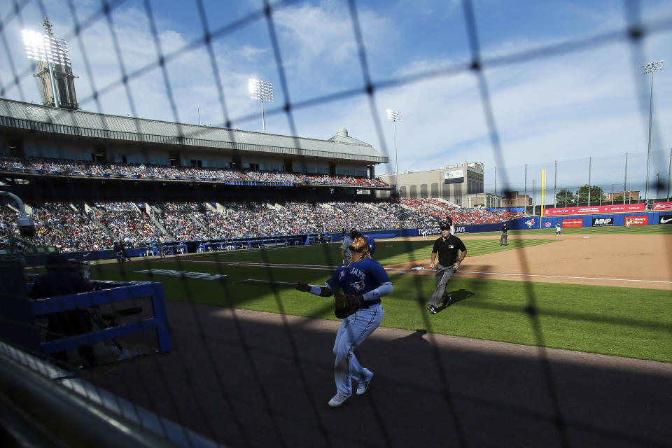 Toronto Blue Jays' first baseman Vladimir Guerrero Jr. (27) tracks a foul ball hit by Houston Astros' Jose Altuve (27) during the eighth inning of a baseball game in Buffalo, N.Y., Saturday, June 5, 2021. (AP Photo/Joshua Bessex)