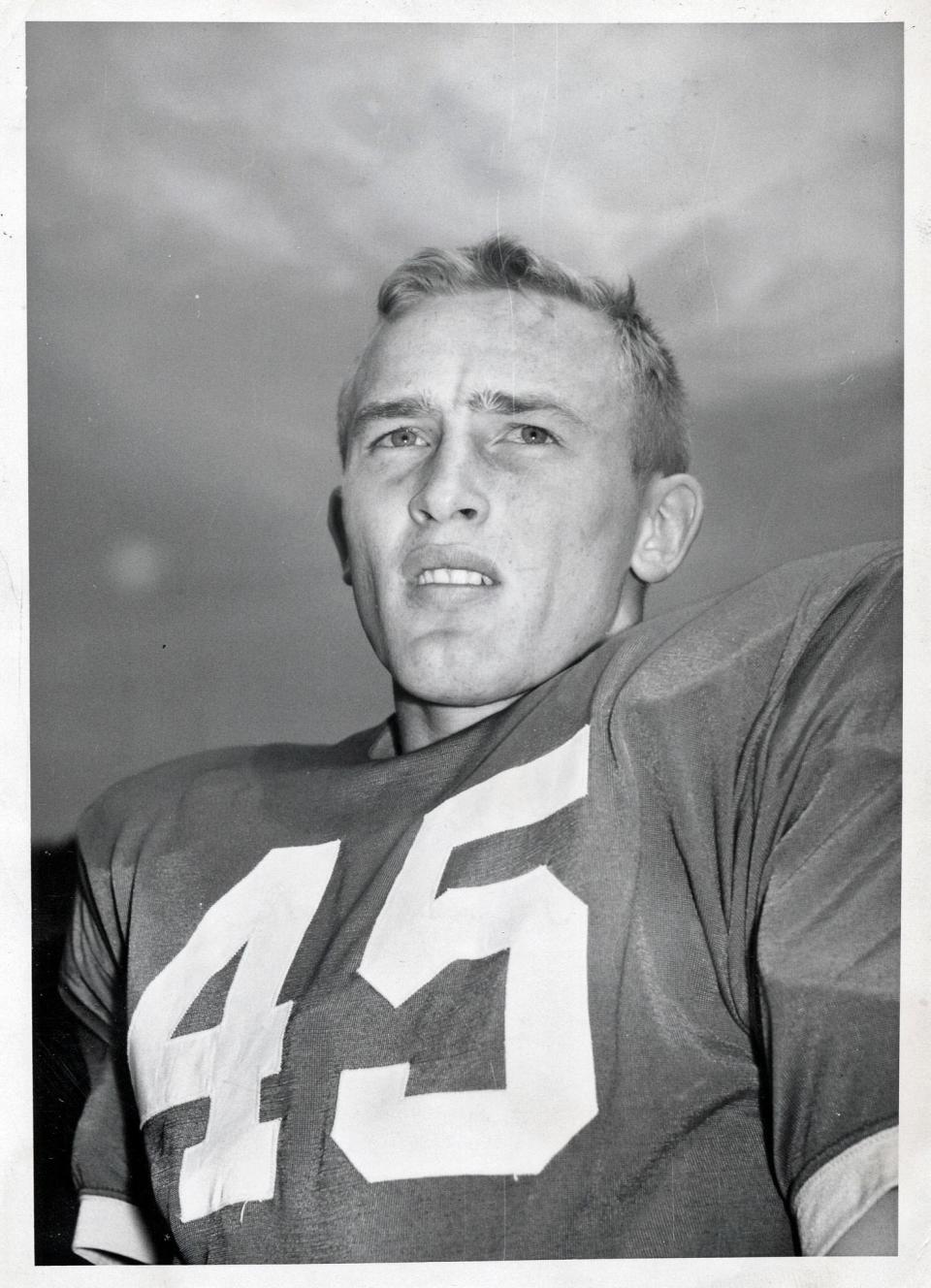 Football -- Black and white file photo of Jim Herbstreit when he played OSU halfback. *** Jim is father of Kirk Herbstreit, ESPN sports analyst and former OSU quarterback. Jim was a co-captain (along with offensive tackle Jim Tyrer) of the 1960 Ohio State team, and was later an assistant coach at OSU under Woody Hayes. When Kirk Herbstreit was named co-captain in 1992, the two became only the second father-and-son duo to have each been Ohio State captains. *** Date on back of print: Oct. 27, 1958. (Dispatch photo by Tom Richards).