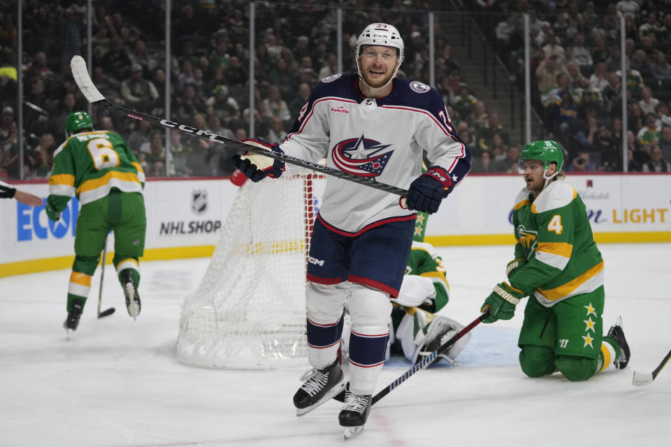 Columbus Blue Jackets right wing Justin Danforth, front, celebrates after a goal during the first period of an NHL hockey game against the Minnesota Wild, Saturday, Oct. 21, 2023, in St. Paul, Minn. (AP Photo/Abbie Parr)