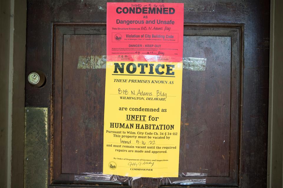 A notice of condemnation is taped to the front door of 820 N. Adams St. on Monday, May 16, 2022.