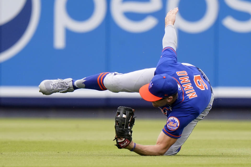 New York Mets center fielder Brandon Nimmo (9) catches a ball hit by Washington Nationals 'Trea Turner during the fifth inning of a spring training baseball game, Monday, March 8, 2021, in West Palm Beach, Fla. (AP Photo/Lynne Sladky)