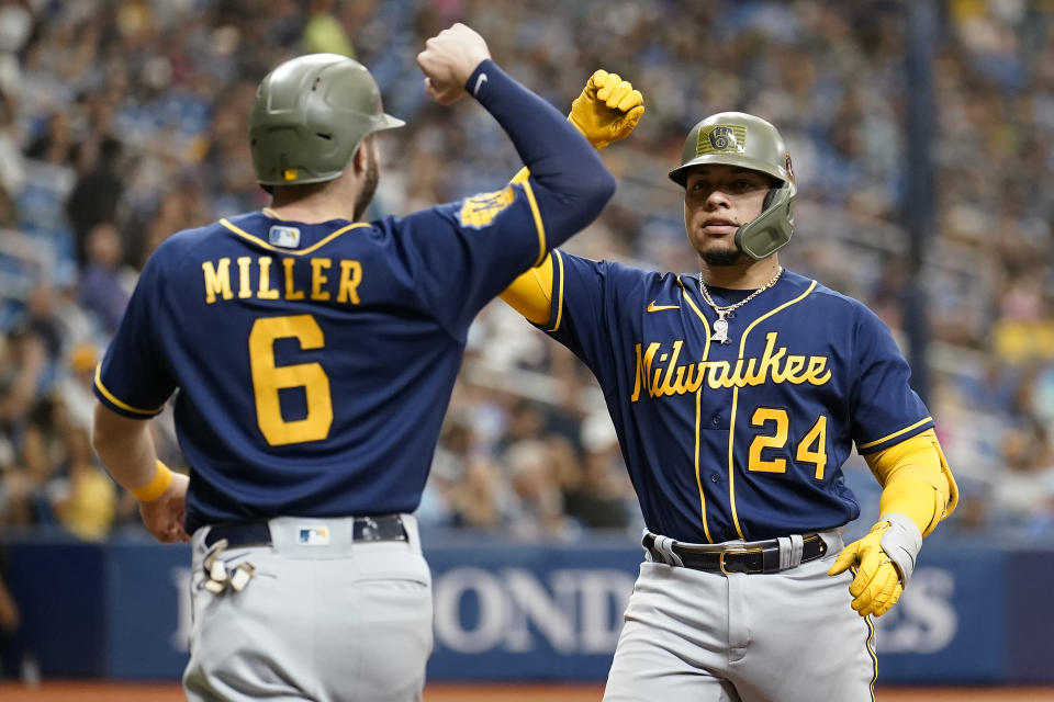 Milwaukee Brewers' William Contreras (24) celebrates his two-run home run off Tampa Bay Rays' Cooper Criswell with Owen Miller (6) during the fifth inning of a baseball game Sunday, May 21, 2023, in St. Petersburg, Fla. (AP Photo/Chris O'Meara)
