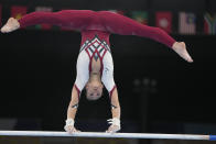 Pauline Schaefer-Betz, of Germany, performs on the uneven bars during the women's artistic gymnastic qualifications at the 2020 Summer Olympics, Sunday, July 25, 2021, in Tokyo. (AP Photo/Natacha Pisarenko)