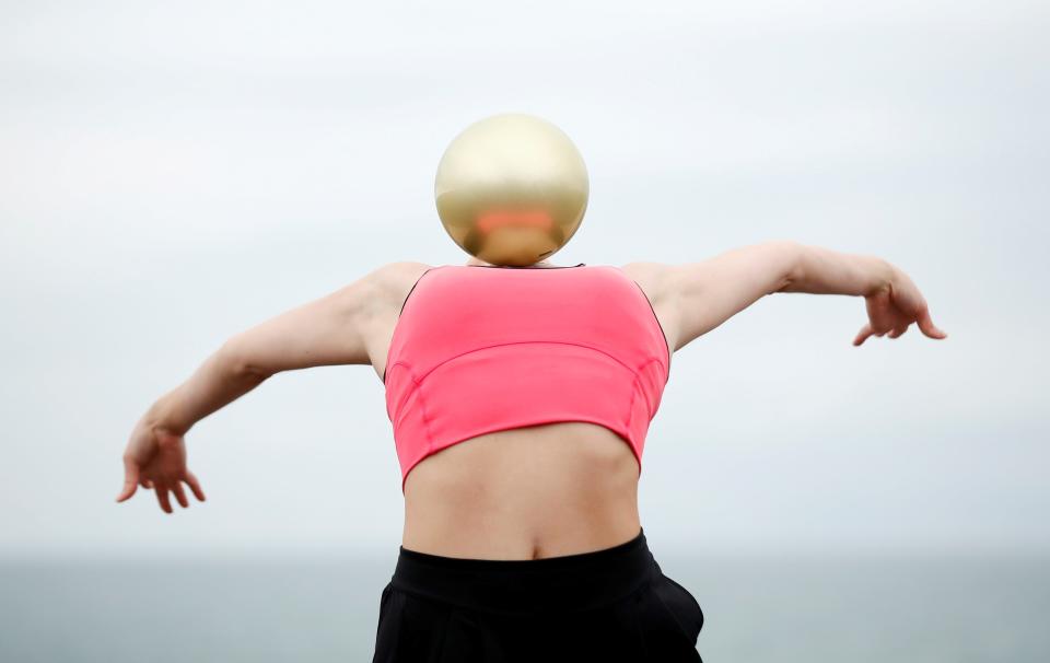 Team GB Rhythmic Gymnast Lynne Karina Hutchison during a training session on the seafront in Hove, following the outbreak of the coronavirus disease (COVID-19), Hove, Britain, June 10, 2020. REUTERS/Peter Cziborra