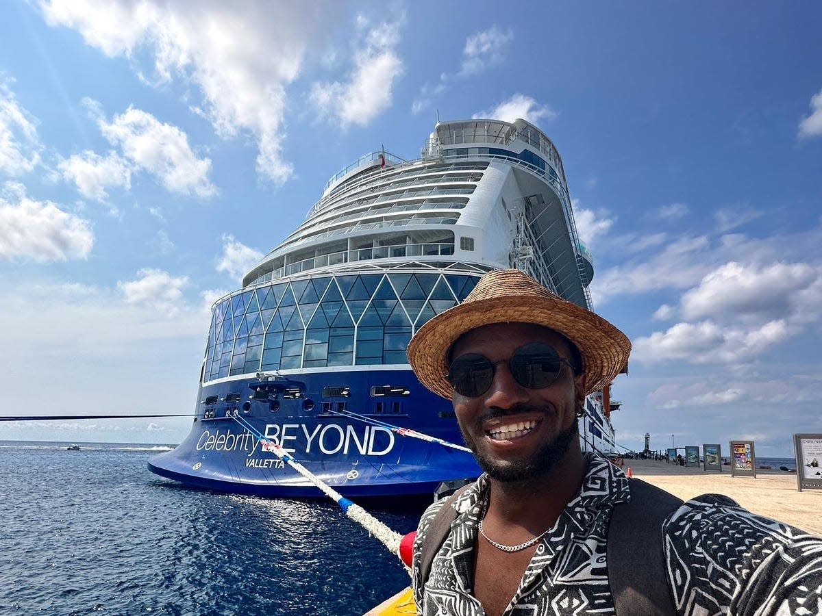 J. Alexander selfie in front of a cruise ship.