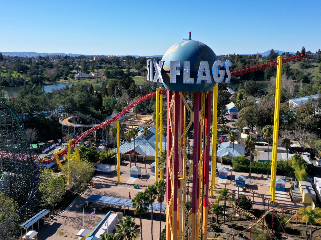 <p>Officials announced in March that theme parks, sports and other outdoor events could resume at limited capacity on 1 April.</p> (Getty Images)
