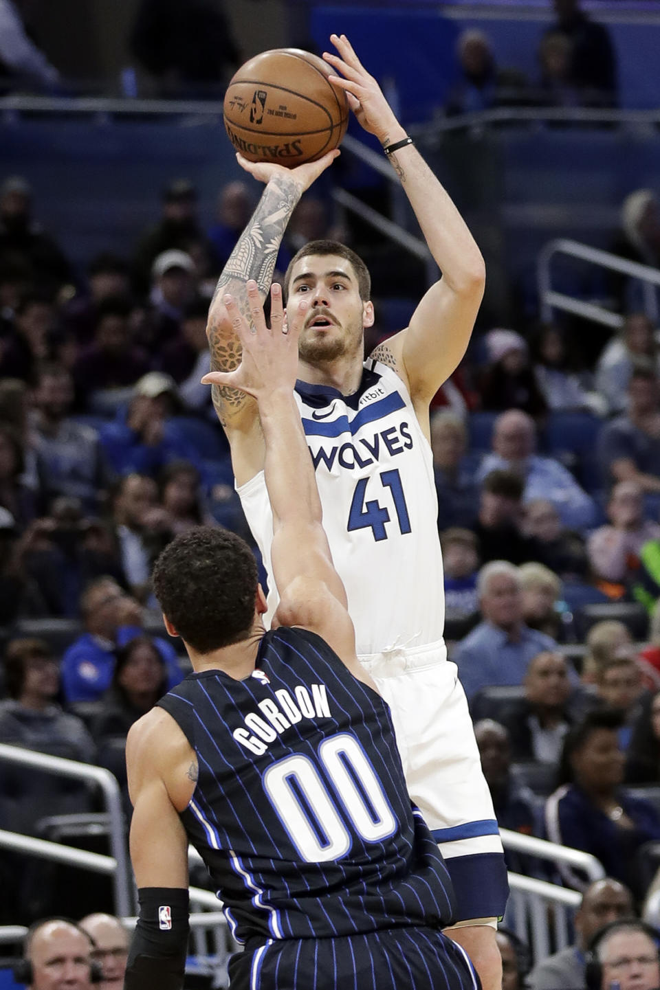 Minnesota Timberwolves forward Juan Hernangomez (41) shoots over Orlando Magic forward Aaron Gordon (00) during the first half of an NBA basketball game Friday, Feb. 28, 2020, in Orlando, Fla. (AP Photo/John Raoux)