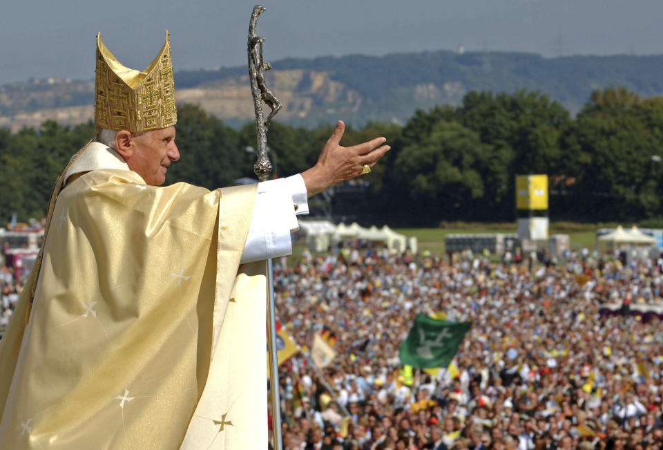 FILE - Pope Benedict XVI waves to the crowd at the end of a papal Mass at the Islinger field in Regensburg, southern Germany, some 120 kilometers (about 75 miles) northeast of Munich, on Tuesday, Sept. 12, 2006. Pope Benedict XVI leaves his homeland with a complicated legacy: pride in a German pontiff but a church deeply divided over the need for reforms in the wake of a sexual abuse scandal in which his own actions of decades ago were faulted. (AP Photo/Wolfgang Radke, Pool, File)