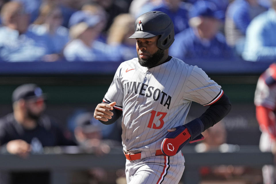 Minnesota Twins' Manuel Margot runs home to score on a double hit by Carlos Correa during the third inning of a baseball game against the Kansas City Royals Thursday, March 28, 2024, in Kansas City, Mo. (AP Photo/Charlie Riedel)