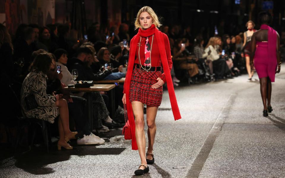 A scarlet scarf and mini-skirt combination