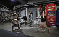 <p>Members of the Ringling Bros. Circus Mongolian Marvels warm up backstage before performing, Friday, May 5, 2017, in Providence, R.I. “The Greatest Show on Earth” is about to put on its last show on earth. For the performers who travel with the Ringling Bros. and Barnum & Bailey Circus, its demise means the end of a unique way of life for hundreds of performers and crew members. (Photo: Julie Jacobson/AP) </p>