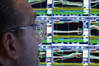 The monitor of specialist Anthony Matesic is seen through his glasses as he works on the floor of the New York Stock Exchange, Wednesday, Aug. 7, 2024. (AP Photo/Richard Drew)