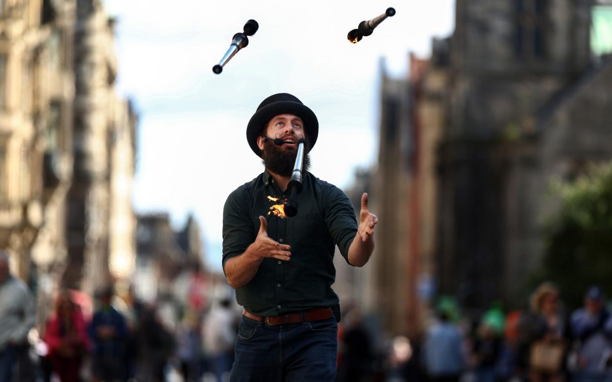 A juggler entertains the crowds at this year's Fringe