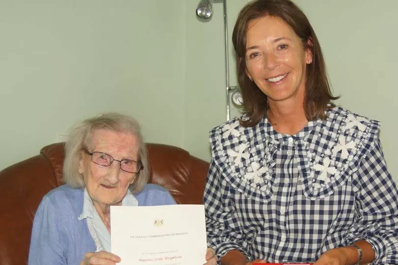 The Duchess of Northumberland presenting the Queen's Commendation for Bravery to Hannah Crackett, the mum of heroic coach driver Maurice Wrightson