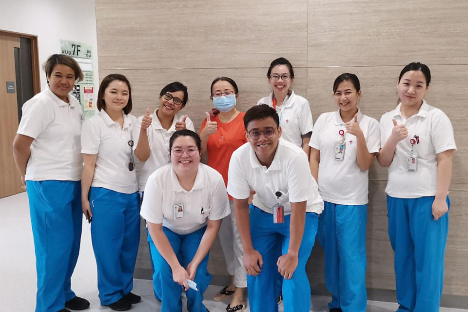 Mrs Zhang (back row, fourth from left) with the healthcare staff at NCID. (PHOTO: Mrs Zhang / MOH)