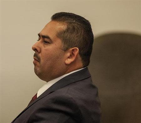 Former Fullerton police officer Manuel Ramos listens as his attorney, John Barnett (now shown) gives his opening statements in the People v. Ramos and Cicinelli trial at Orange County Superior Court in Santa Ana, California, December 2, 2013. REUTERS/Bruce Chambers/Pool