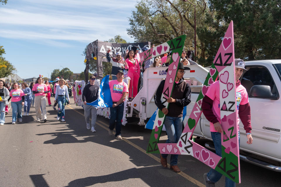 Members of Delta Zeta and Phi Delta Theta show off their joint float Saturday afternoon at the WT Homecoming Parade in Canyon.