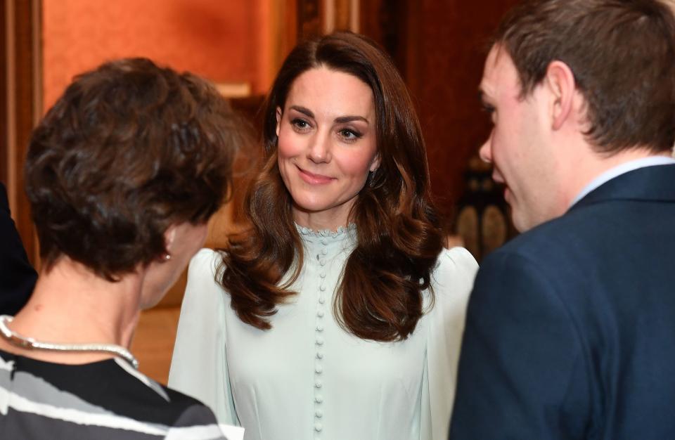 Catherine, Duchess of Cambridge, talks with guests as she attends a reception to mark the 50th Anniversary of the investiture of The Prince of Wales.&nbsp; (Photo: DOMINIC LIPINSKI via Getty Images)