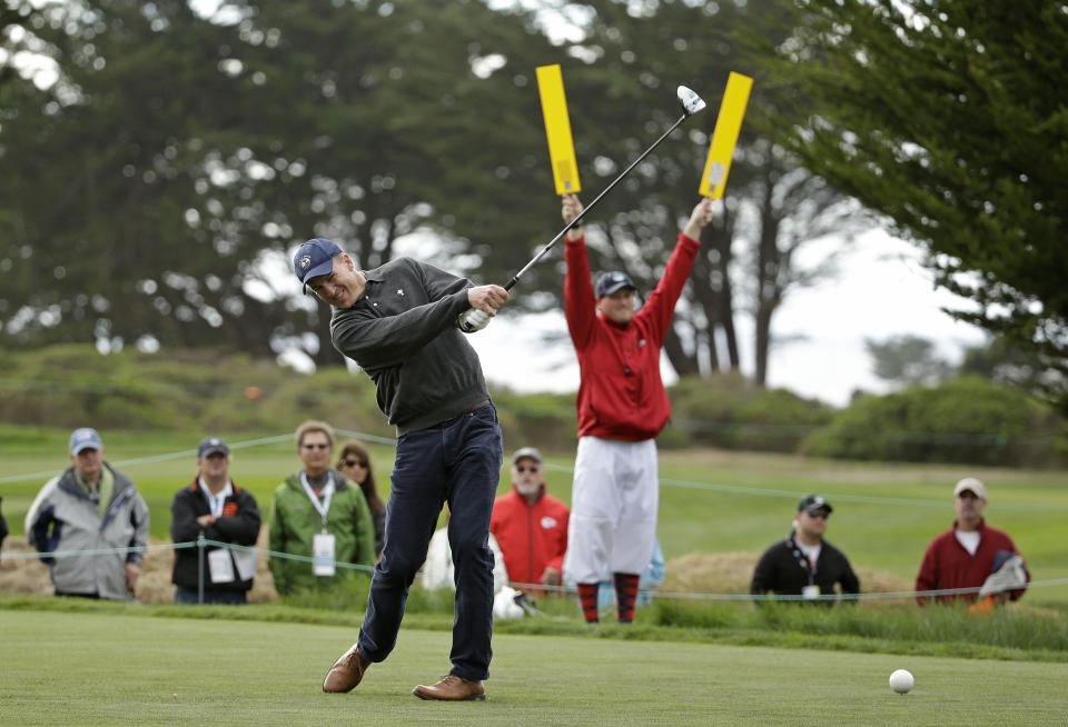 Denver Broncos quarterback Peyton Manning follows his drive from the 17th tee of the Monterey Peninsula Country Club Shore Course during the first round of the AT&T Pebble Beach Pro-Am golf tournament Thursday, Feb. 6, 2014, in Pebble Beach, Calif. (AP Photo/Eric Risberg)