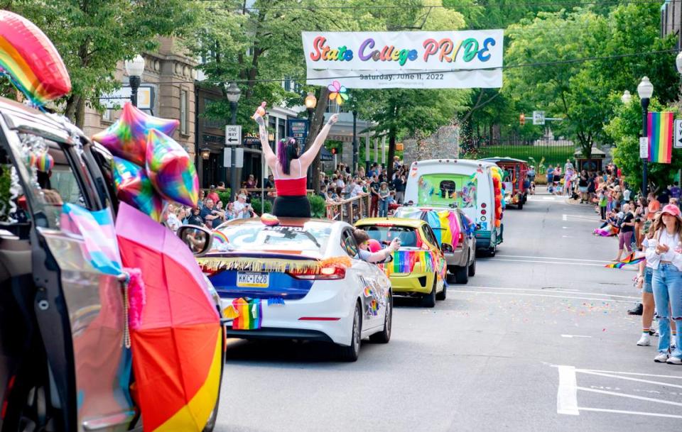 Community members line Allen Street for the State College “Pride Ride” parade on Saturday, June 11, 2022.