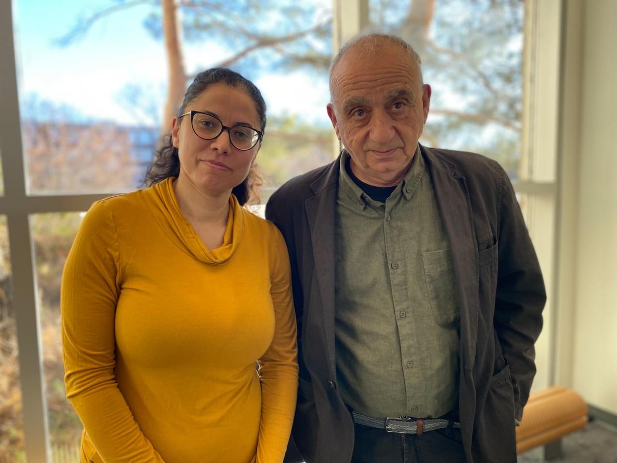 Rania Al-Harthi is Palestinian-Jordanian-Russian-Canadian. Arthur Milner is a Jewish-Polish-Canadian. They have both written plays based on Israel and Palestine. (Nichole Huck/CBC - image credit)