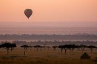 <p>Perched (and seemingly suspended) above the dramatic Masai Mara game reserve in Kenya sits the intimate and exceedingly luxurious <a rel="nofollow noopener" href="https://www.angama.com/" target="_blank" data-ylk="slk:Angama Mara;elm:context_link;itc:0;sec:content-canvas" class="link ">Angama Mara</a>. Spread out on one of the most dramatic stretches in the world, The North and South Camps comprise elegant, spacious tents, all with views that will leave you inspired and energized (although tent #7 might win out as a favorite). </p><p>Overlooking the iconic site of the <em>Out of Africa</em> film, this gem was literally built with the best views in mind. Just a short drive by Land Rover Defender, you can experience some of the best animal spotting and game drives in Africa, where you may even see The Big 5 on your first day. From the property’s dramatic position, take binoculars or try the telescope and you will see elephants gently grazing, prides of female lions sunbathing, and in the "Green Season,’" watch the power of nature come alive with fleeting storms that roll in slowly from the distance and depart leaving things cooled down and lush. In fact, the "Green Season" will grant you privileged access to some of the best animal sightings in the world, which explains why <a rel="nofollow noopener" href="https://www.angama.com/experience/photography/" target="_blank" data-ylk="slk:photographers;elm:context_link;itc:0;sec:content-canvas" class="link ">photographers</a> flock to Angama Mara for the views and access to the natural world. </p><p>Pro tip: take in the <em>Out of Africa</em> views by hot air balloon and 'forage' for your lunch in the organic garden overlooking the valley below–best enjoyed with crisp rose in hand. Notably, Angama Mara hosts Sundowners at least once during your stay, where in a setting overlooking the picnic spot made famous by the Meryl Streep and Robert Redford film, you can enjoy a Pimm’s Cups as you unwind in camp chairs with cashmere blankets as the local Masai Men perform an amazing ritual dance, all light by tiki torches and candlelight.</p>