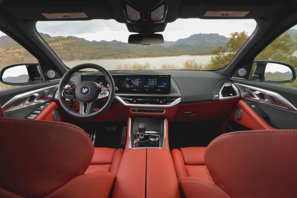 <p>The XM comes standard with nearly every luxury feature and driver aid in BMW's toy box, from heated armrests to the latest curved-screen infotainment display. </p>