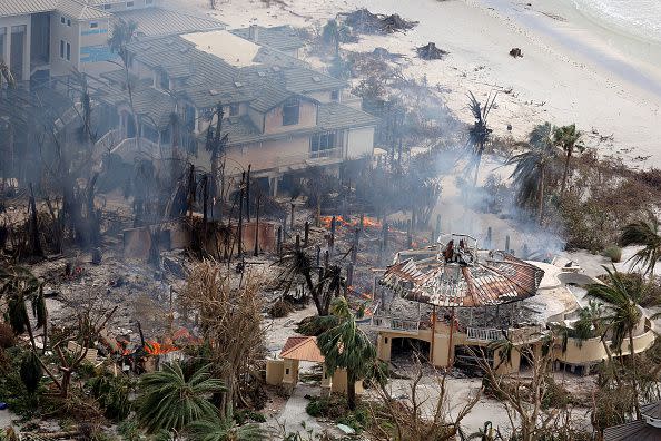 In this aerial view, a home burns after Hurricane Ian passed through the area on September 29, 2022, in Sanibel, Florida.