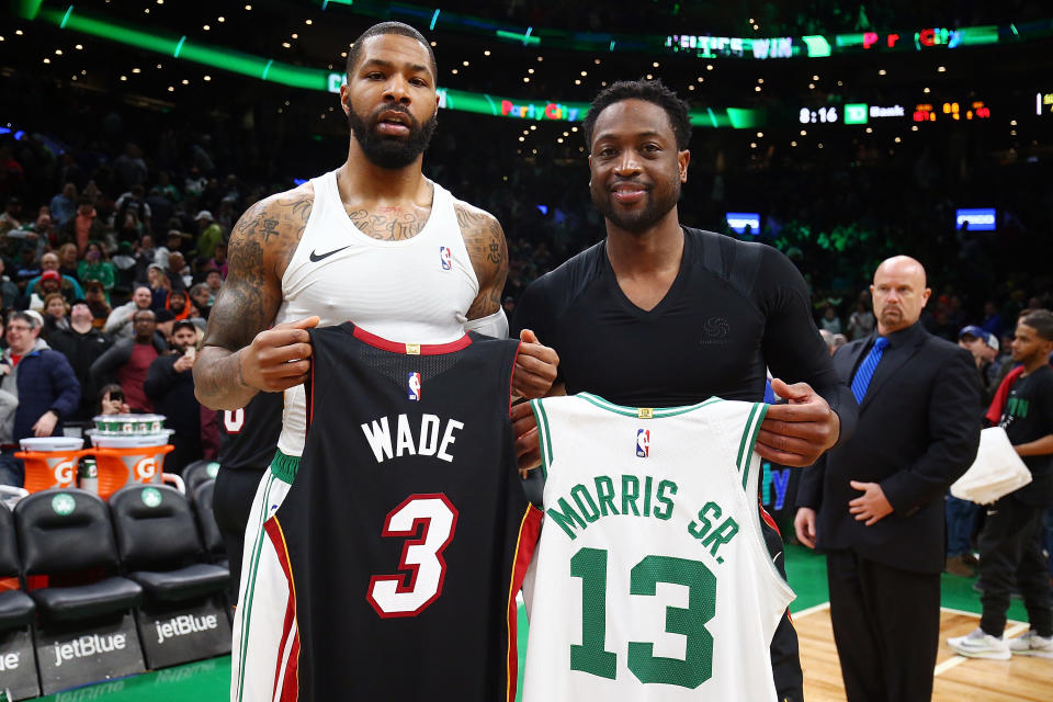 The Celtics’ Marcus Morris (L) and Dwyane Wade swap jerseys after Monday’s game in Boston. (Getty Images)