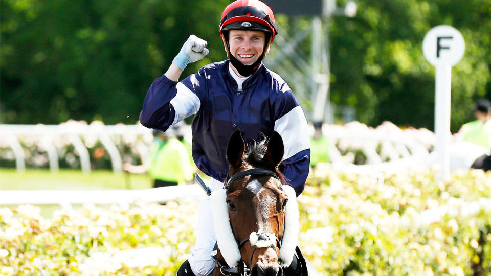 Jye McNiel riding Twilight Payment returns to scale after winning race 7 at the Melbourne Cup.