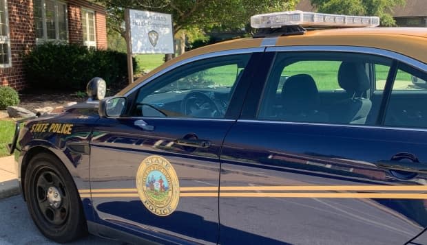 A police car parked outside the Berkeley County health department in Martinsburg, W. Va. The office, which includes a clinic, added security after health care workers reported being verbally abused in person and online. Opposition to vaccination and COVID-19 measures has been ramping up in several states in the wake of U.S. President Joe Biden's executive orders mandating vaccines in some sectors. (Alex Panetta/CBC News - image credit)