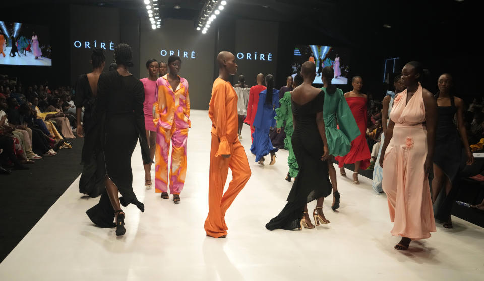 Models wear a creation by Orire during the Lagos Fashion Week in Lagos, Nigeria, Thursday, Oct. 26, 2023. Africa's fashion industry is rapidly growing to meet local and international demands but a lack of adequate investment still limits its full potential, UNESCO said Thursday in its new report released at this year's Lagos Fashion Week show. (AP Photo/Sunday Alamba)