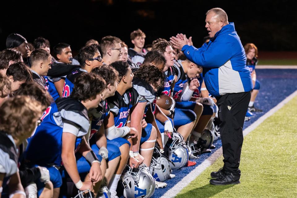 Auburn High football coach Jeff Cormier talks to the team after they defeated Swampscott during the continuation of a game from Week 1, that was suspended by lightning, on Tuesday October 17, 2023.