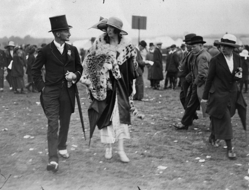 June 1922:  Major and Mrs Hedges stride purposefully about in their finery at Ascot (Getty Images)