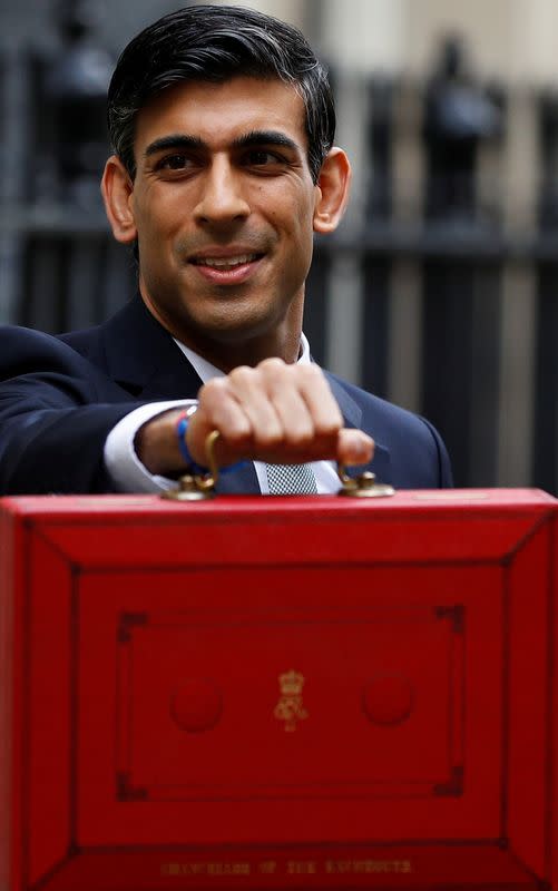 Britain's Chancellor of the Exchequer Rishi Sunak holds the budget box outside his office in Downing Street in London