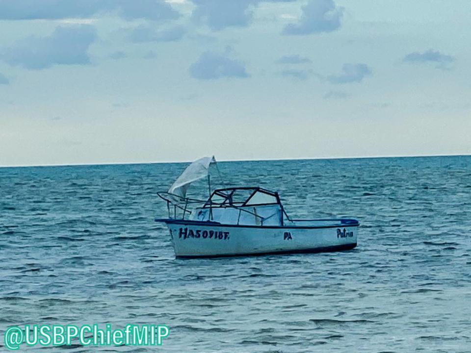 A boat floats off shore of Grassy Key in the Florida Keys Monday morning, Nov. 30, 2020. Six people from Cuba arrived in the Keys on the vessel.