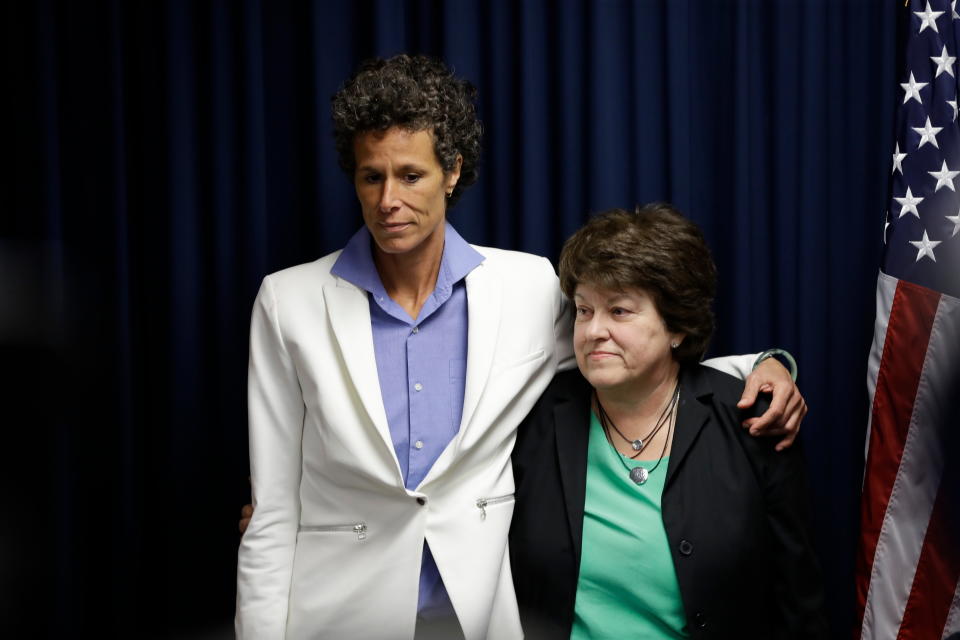 FILE - In this Thursday, April 26, 2018, file photo, Bill Cosby accuser Andrea Constand, left, and her attorney Dolores Troiani listen during a news conference after Cosby was found guilty in his sexual assault trial, in Norristown, Pa. Constand’s defamation lawsuit against former prosecutor Bruce Castor has been settled. Troiani said Thursday, Jan. 31, 2019, that the terms are confidential and both sides agreed not to comment. (AP Photo/Matt Slocum, File)