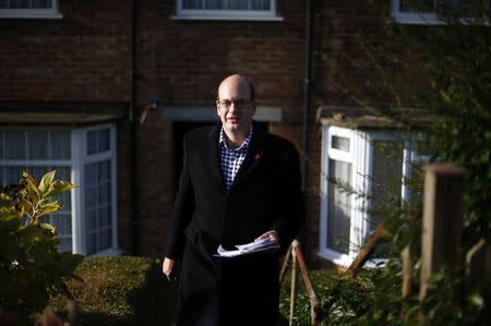 Mark Reckless, the former Conservative local MP now standing for United Kingdom Independence Party (UKIP), canvases for votes in the by-election in Strood, in southeastern England, November 11, 2014. REUTERS/Andrew Winning