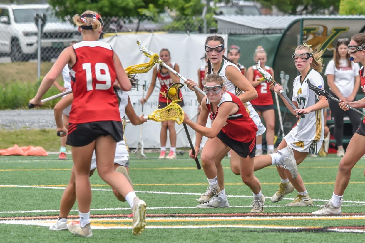 CVU's Stella Dooley starts the fast break during the Redhawks' 2023 D1 Championship overtime loss to the Burr and Burton Bulldogs at UVM's Virtue Field.