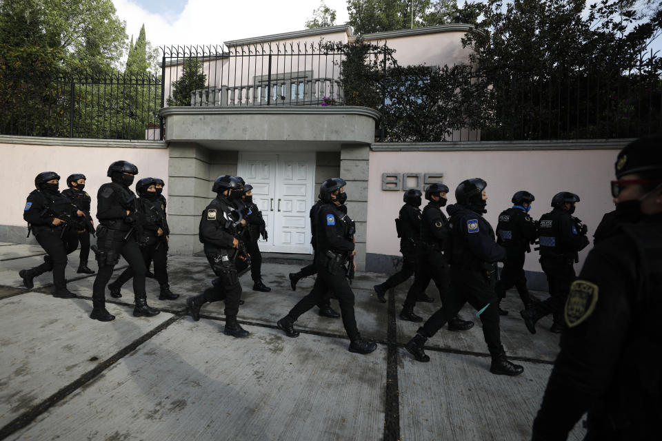 Police arrive to the scene where security secretary, Omar García Harfuch, was attacked by gunmen in the early morning hours in Mexico City, Friday, June 26, 2020. Heavily armed gunmen attacked and wounded Mexico City's police chief in a brazen operation that left an unspecified number of dead, Mayor Claudia Sheinbaum said Friday. (AP Photo/Rebecca Blackwell)