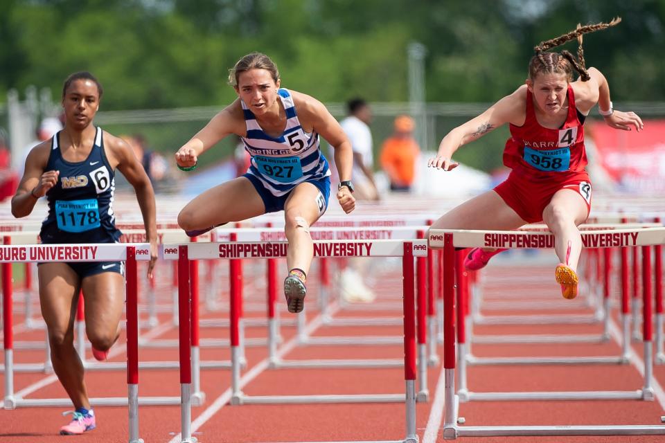 Spring Grove's Ella Bahn and Susquehannock's Ryleigh Marks go one and two in the 3A 100-meter hurdles during the PIAA District 3 Track and Field Championships at Shippensburg University Saturday, May 20, 2023.