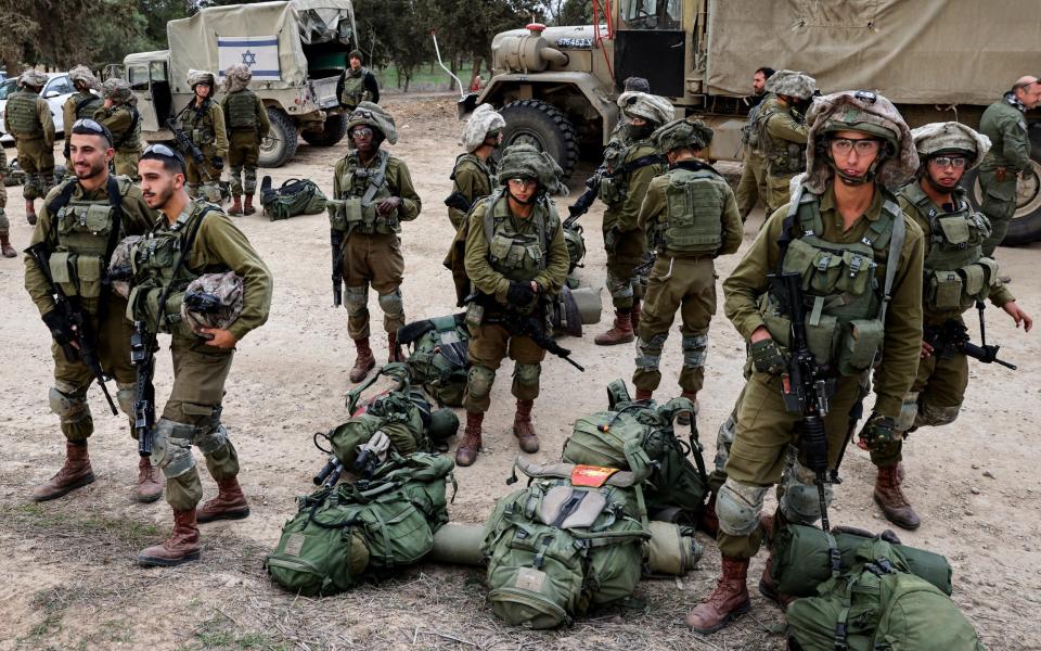 Israeli soldiers along the Israeli Gaza border area in southern Israel