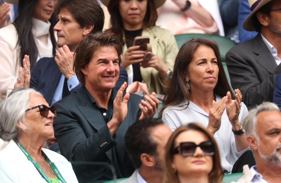 Tom Cruise applauds from the Royal Box during day thirteen of The Championships Wimbledon 2024 at All England Lawn Tennis and Croquet Club on July 13, 2024 in London.