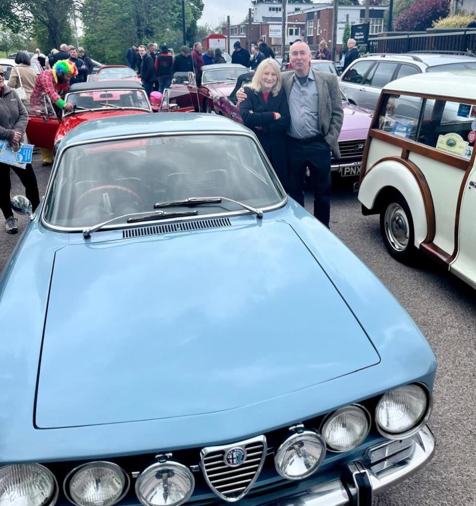 Stourbridge News: Stourbridge MP Suzanne Webb with car owner Jeremy Humphries at the Worcestershire County Boundary Classic Car Tour in Norton